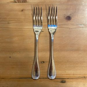 Two Christofle Malmaison pattern silver plate fish forks